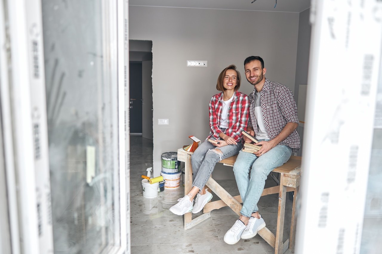 two-smiling-workers-holding-colored-fiberboard-sam-2026-01-05-06-35-26-utc